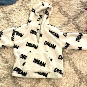 insulated white and black half zip jacket.